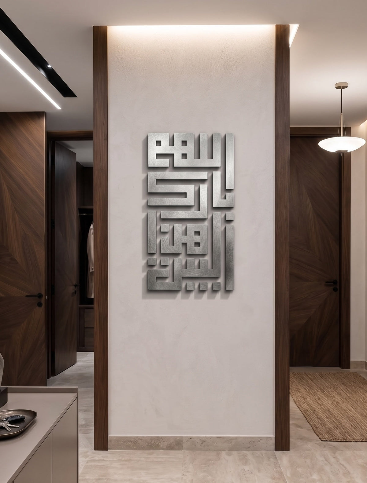 A modern interior hallway with a large metallic Arabic calligraphy wall art piece mounted on a light beige wall, flanked by dark wood trim and doors.