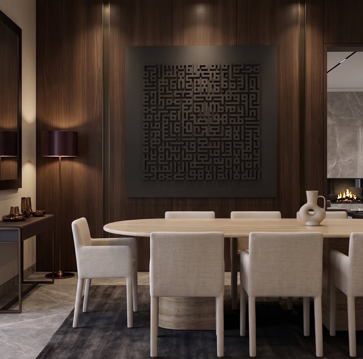 A modern dining room scene with a round light wood dining table and six upholstered cream chairs, set against dark wood-paneled walls with a large black geometric wall art piece above. A fireplace, side table, and floor lamp are visible in the room.